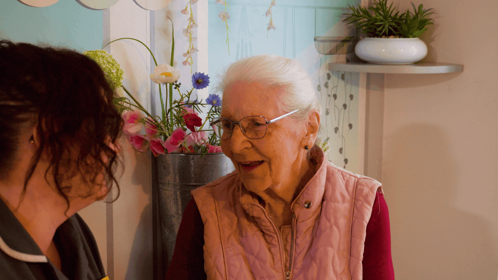 A Canwick House resident sharing a warm, happy moment with a carer